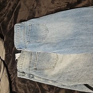 2 pairs of very distressed jeans